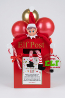 Elf on the Shelf in a red mailbox labeled 'Elf Post' with balloons in the background.