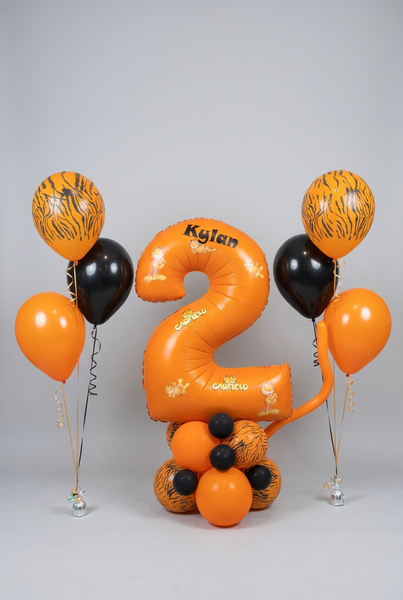 Orange Garfield number 2 balloon personalised with Kylan on an orange, black and tiger-print base, with two matching three-balloon helium bouquets.