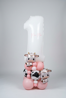White number 1 balloon personalised with Mia-Mae in pink, with two cow foil balloons and a pink, white and cow-print balloon base.