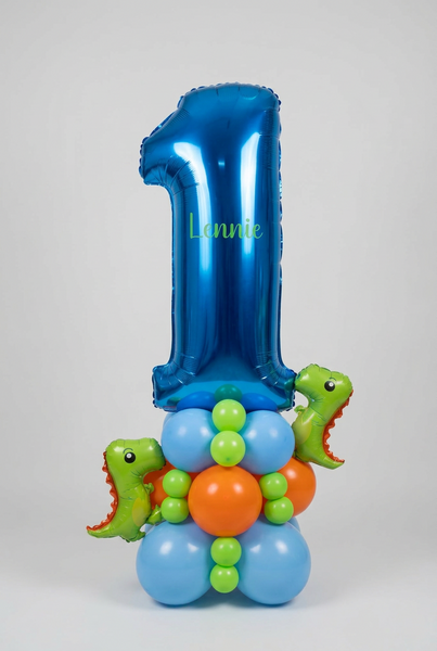 Metallic blue number 1 balloon personalised with Lennie, on a blue, orange and green balloon base with two mini dinosaur balloons.