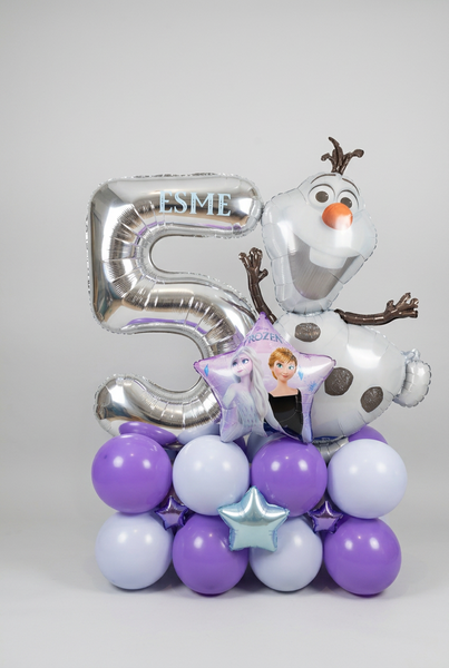 Silver number 5 balloon personalised with Esme, alongside Olaf and an Anna and Elsa star balloon, on a purple and pale blue base with foil stars.