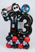 Black number 13 balloons with Manchester United crests, personalised wording and a photo, gaming foil balloons and a red, black and blue balloon base.