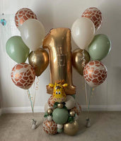 Personalised gold number 1 balloon with a giraffe-themed sage, cream and gold base, beside two matching five-balloon helium bouquets.