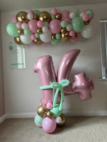 Personalised birthday number balloons with a matching garland in your chosen colours. Portland collection and local delivery and setup available.