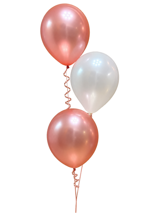 Two rose gold and white helium balloon bouquets, each containing three latex balloons with curling ribbons