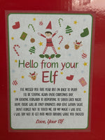 Christmas card with an elf design and text on a red background