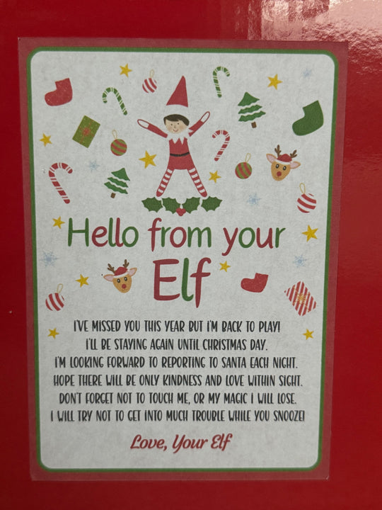 Christmas card with an elf design and text on a red background